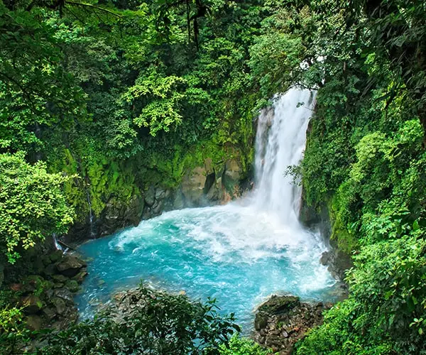 A lush waterfall in the jungle in Volcán Tenorio in Costa Rica