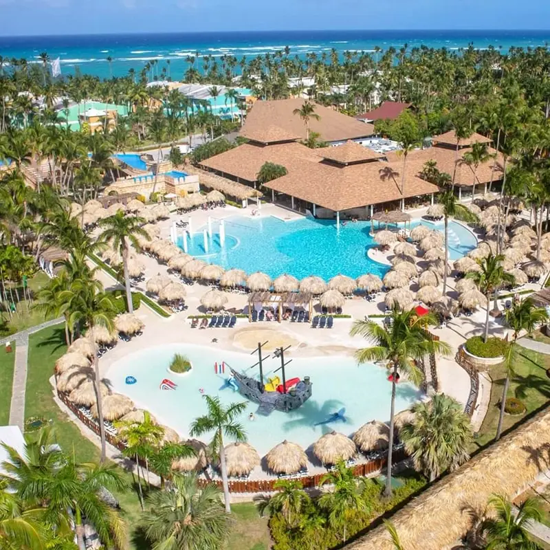 An overview of the Grand Palladium Punta Cana with pools and palm trees.