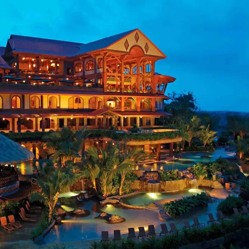 The Springs Resort lit up at dusk.